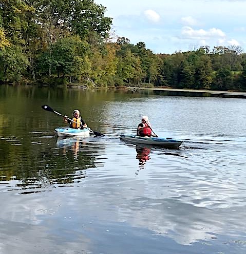 Loretta and Theresa enjoy kayaking on the Lake at Omega.