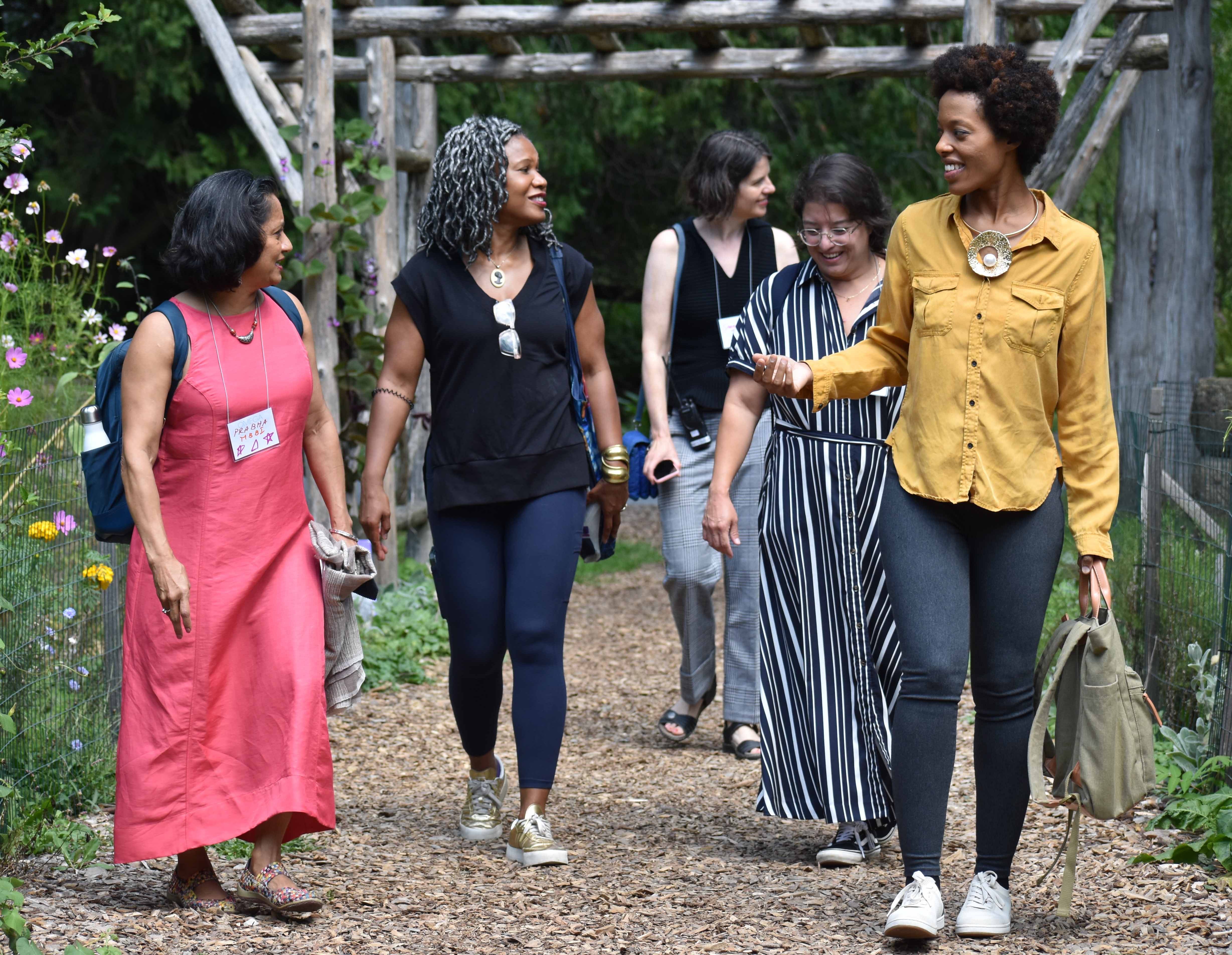 Wellbeing Summit faculty walking in garden