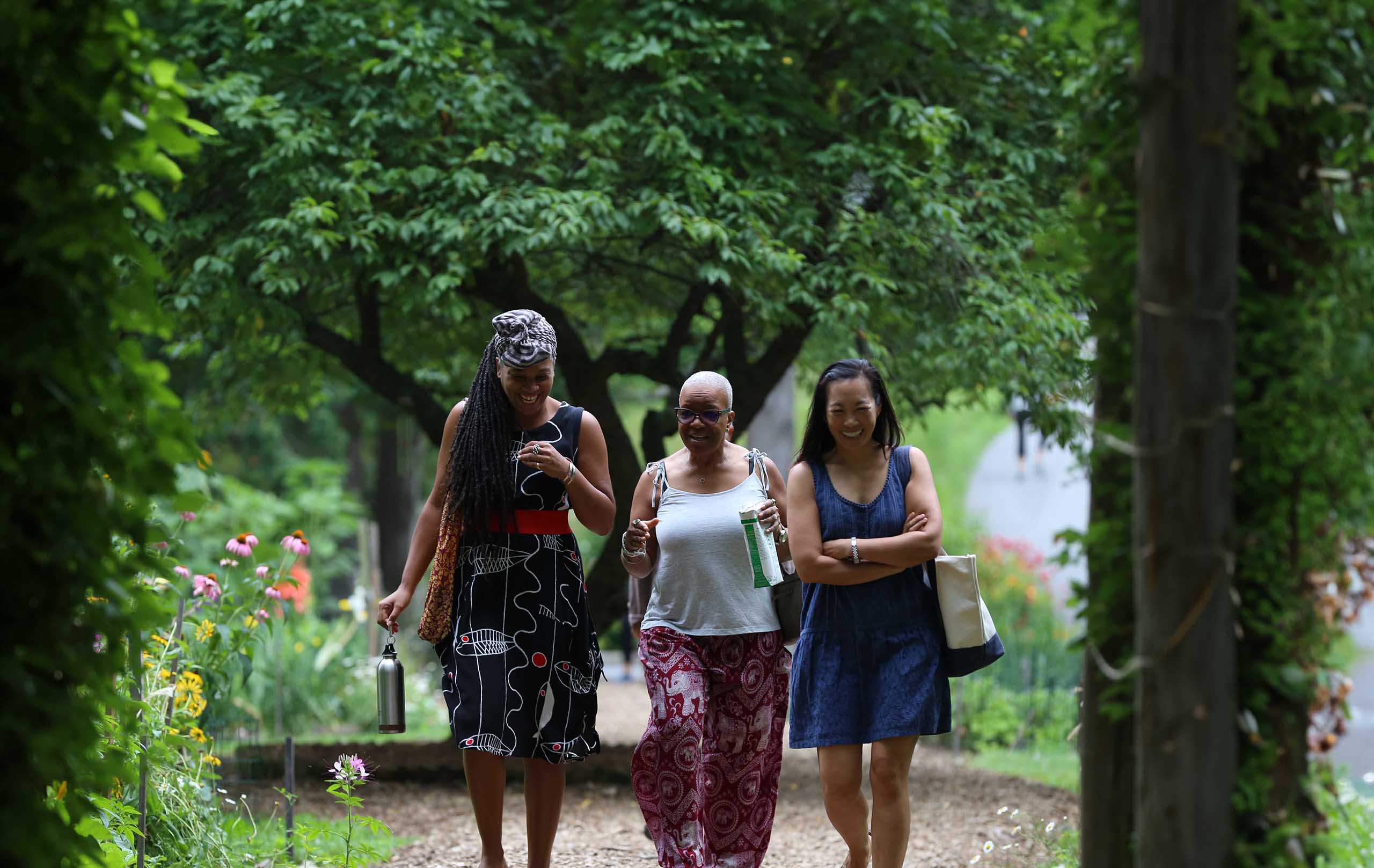 Women walking on a path at Omega