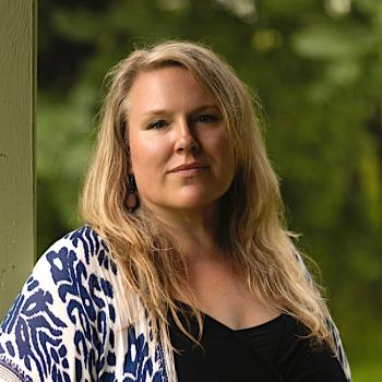 Joy Lynn Okoye is a trauma-informed embodiment guide, sacred storyteller, yoga nidra facilitator, and founder of SoulEase.