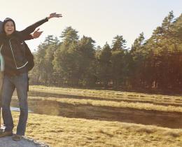 Group of friends standing on a rock