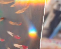 Close-up of a person painting abstract art on canvas, illustrating creativity and mental well-being