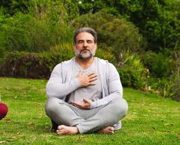 Participants practicing breathwork outdoors, focusing on conscious breathing and relaxation.