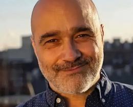 Omega faculty Dimitri Mugianis