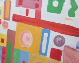 Person painting a colorful abstract canvas, illustrating the mental health benefits of creativity, stress relief, and art-making.