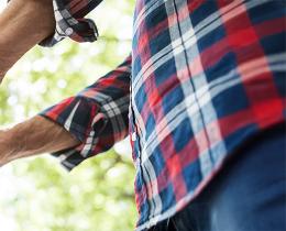 Couple holding hands in a circle, symbolizing connection and healing in family and relationship workshops at Omega Institute.