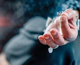 Woman sitting in lotus pose with thumbs and forefingers touching and ray of light, signifying motional healing and spiritual transformation.