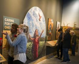 People looking at an exhibit at the Wild Center