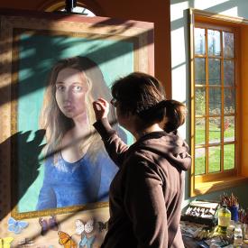 Lois Guarino working on a portrait