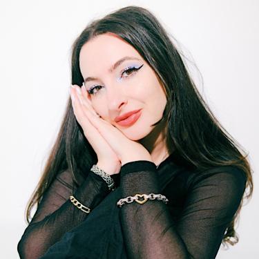 Aliza Kelly is an astrologer, author, and spiritual guide whose work bridges astrology and empowerment.