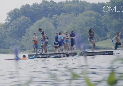 Kids playing on floating platform in lake