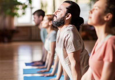 Group of people practicing in yoga studio