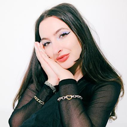 Aliza Kelly is an astrologer, author, and spiritual guide whose work bridges astrology and empowerment.