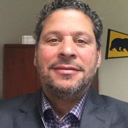 Omega faculty Curtiss Sarikey