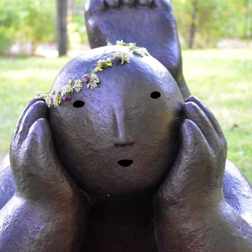 Joy Brown - Recliner with flower tiara