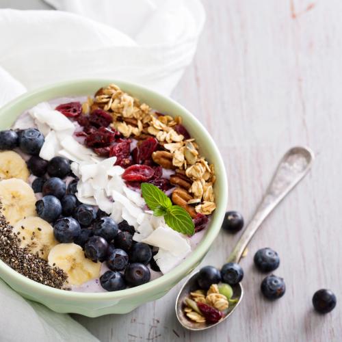 A bowl of porridge with colorful toppings