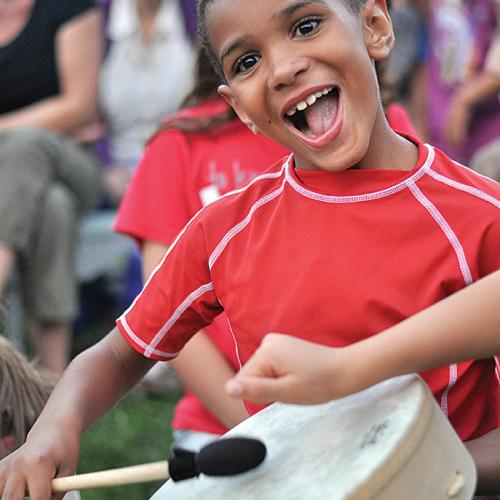 Kid playing a drum
