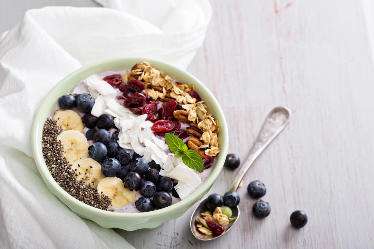 A bowl of porridge with colorful toppings