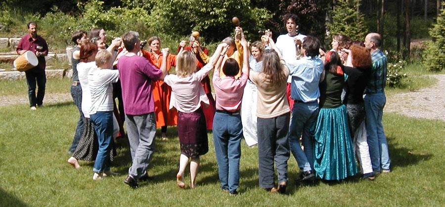 Tom Holmes leads a group exercise outside at Omega
