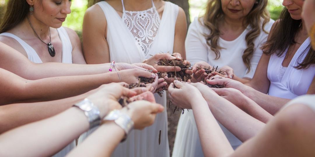 Group of women connecting with each other and the earth.