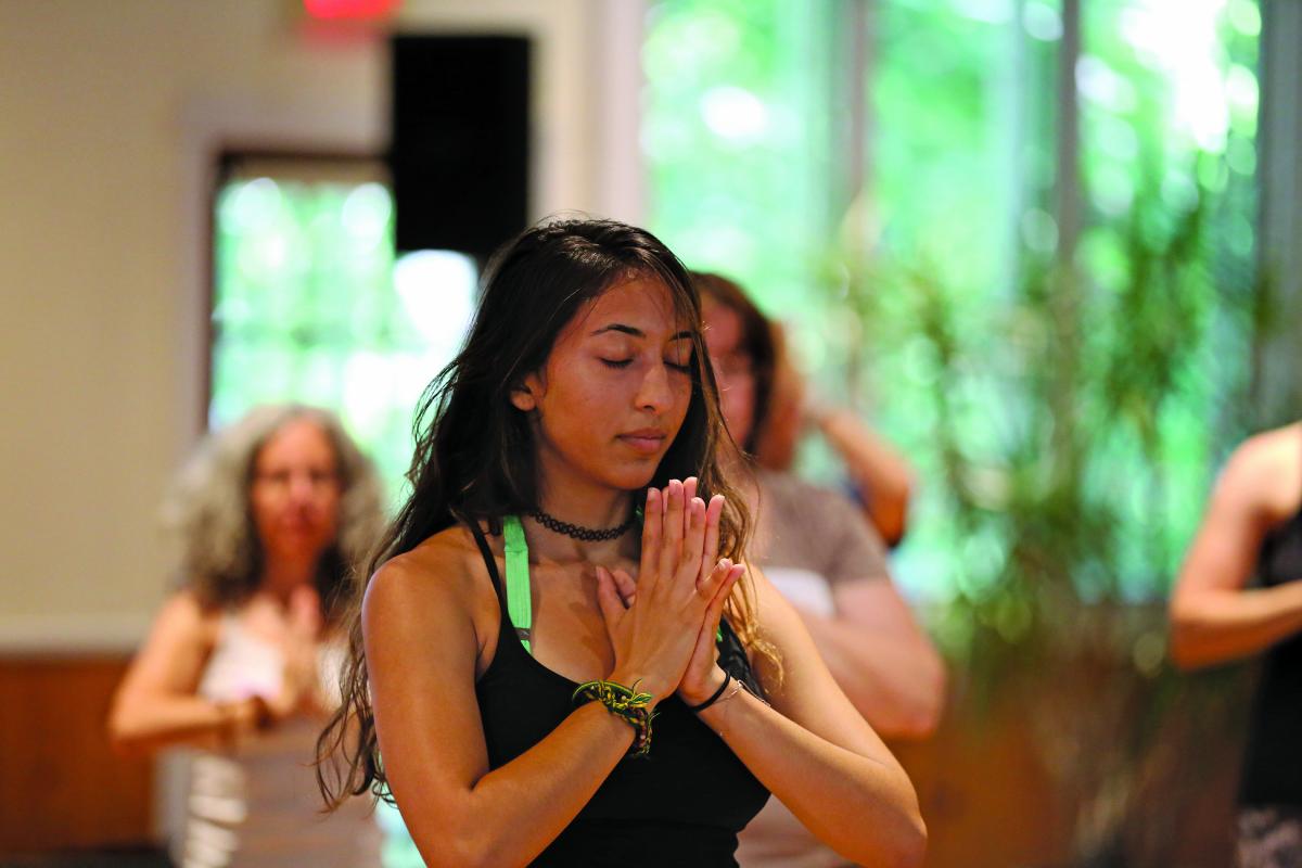 Young woman doing yoga in a class