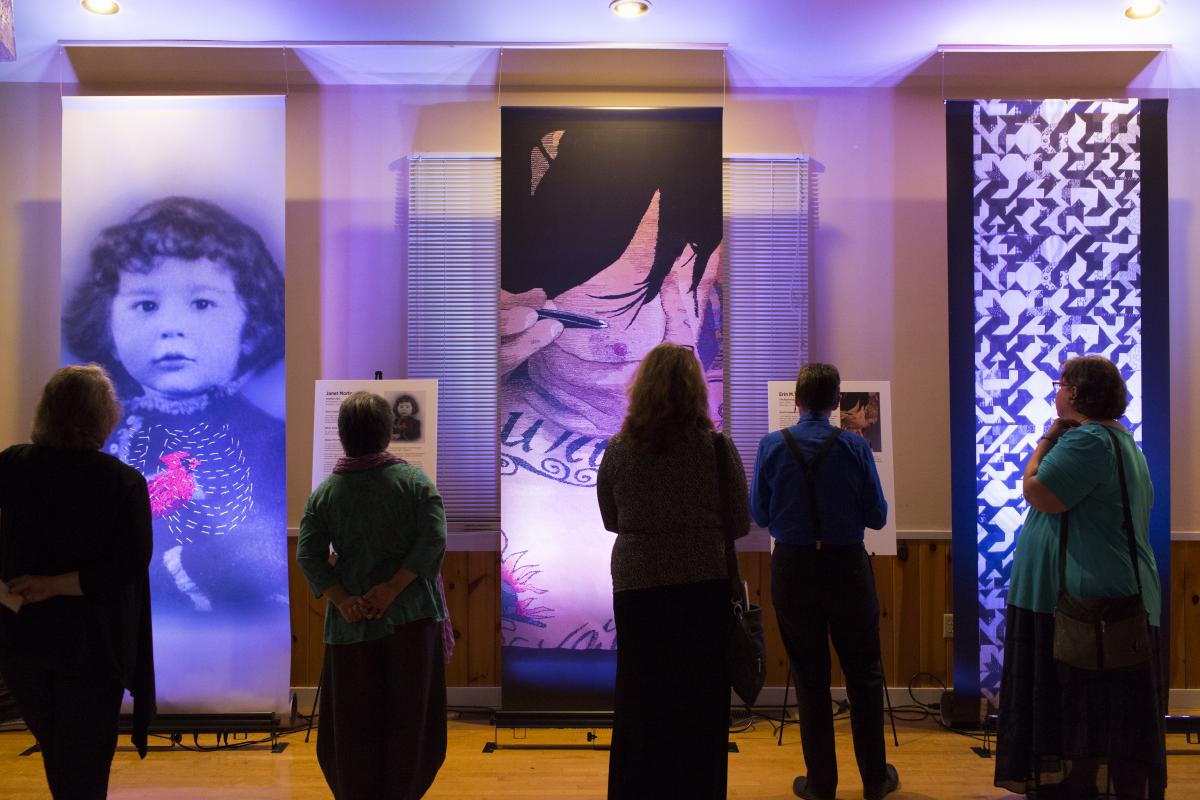 Visitors enjoy the Threads exhibition