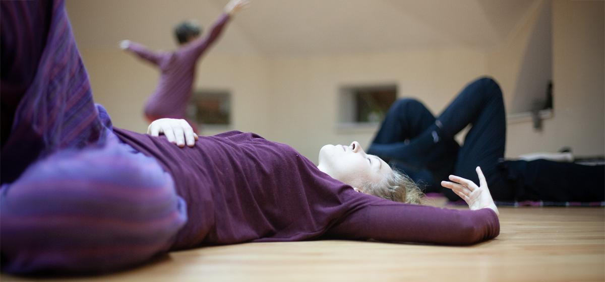 Group of people in a somatic movement exercise