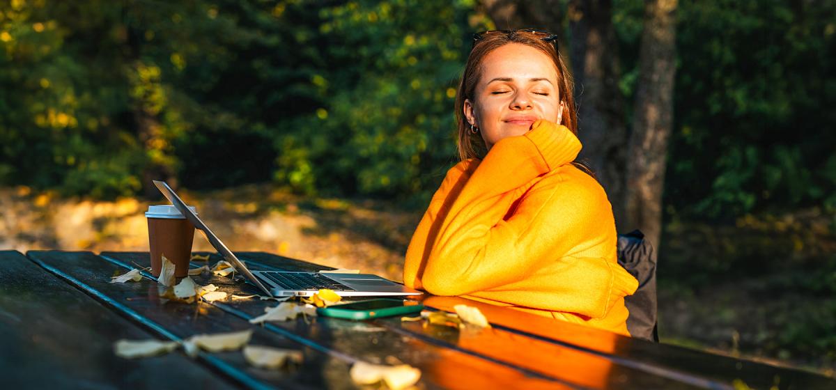 Woman taking a break from using her digital devices and reconnecting with herself