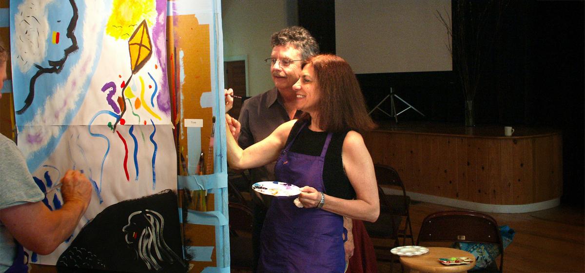 Stewart Cubley and a participant painting