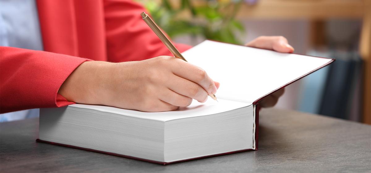 Author signing their book.