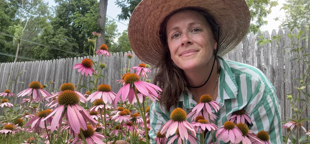 Missy Bateson in a field of coneflowers