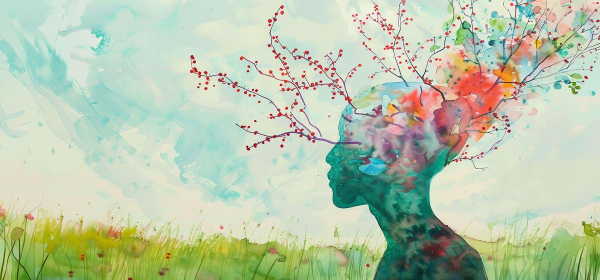 Watercolor painting of a person's head with flowers growing from the brain