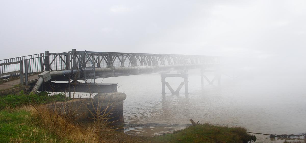 Foot bridge into the fog