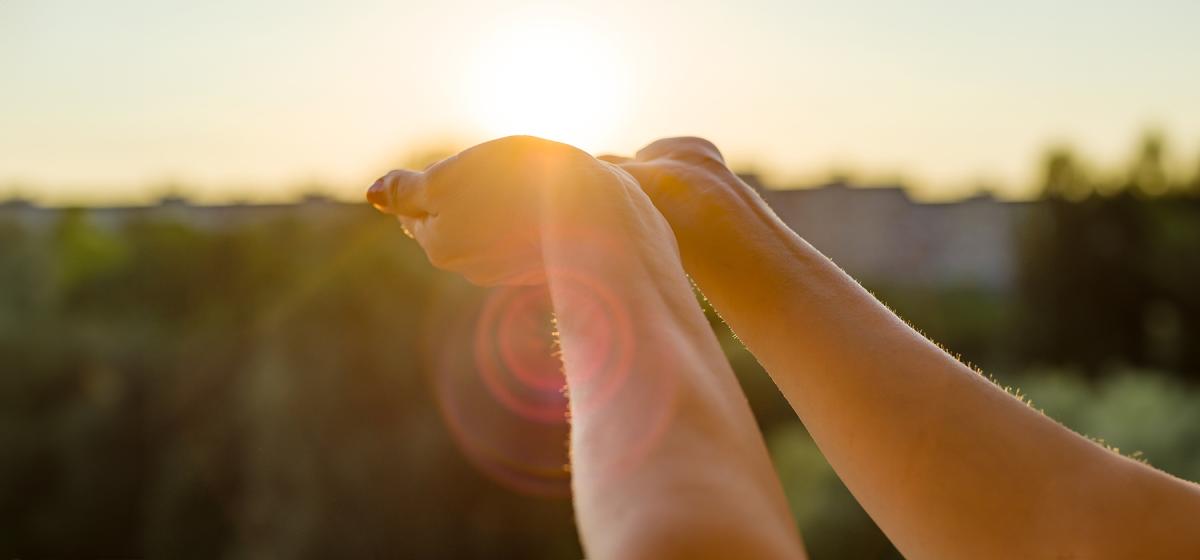Hands reaching to the sky to receive messages from Spirit