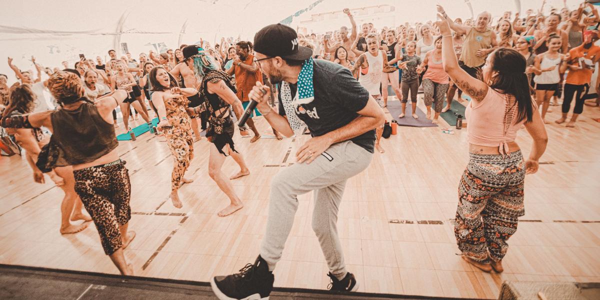 MC Yogi leading an energetic session