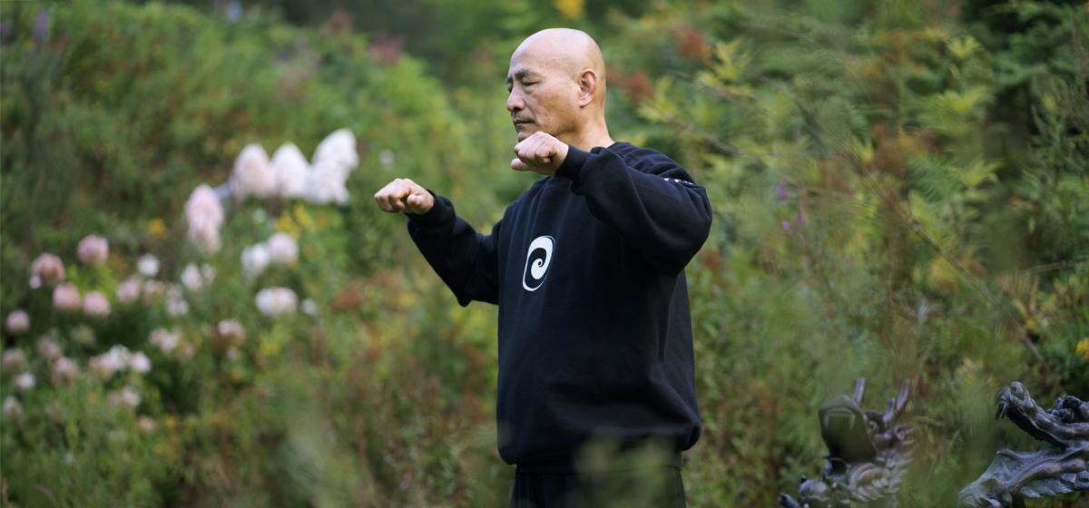 Grand Master Nan Lu practicing Qigong outside
