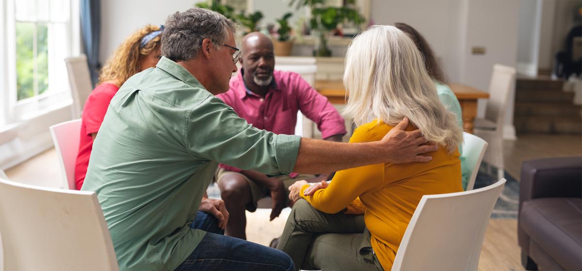 Group of people in group therapy circle
