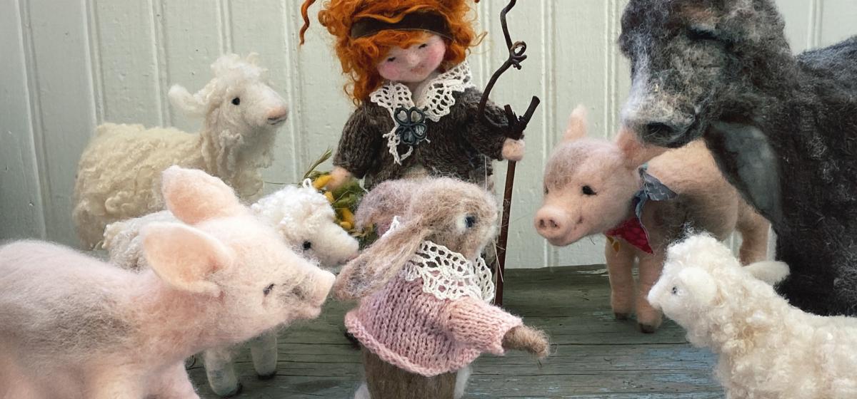 Felted wool figures depicting a woodland story