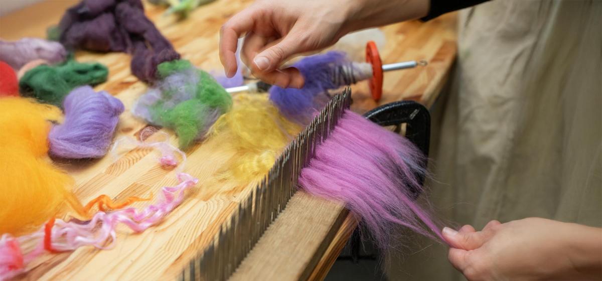 Person combing wool