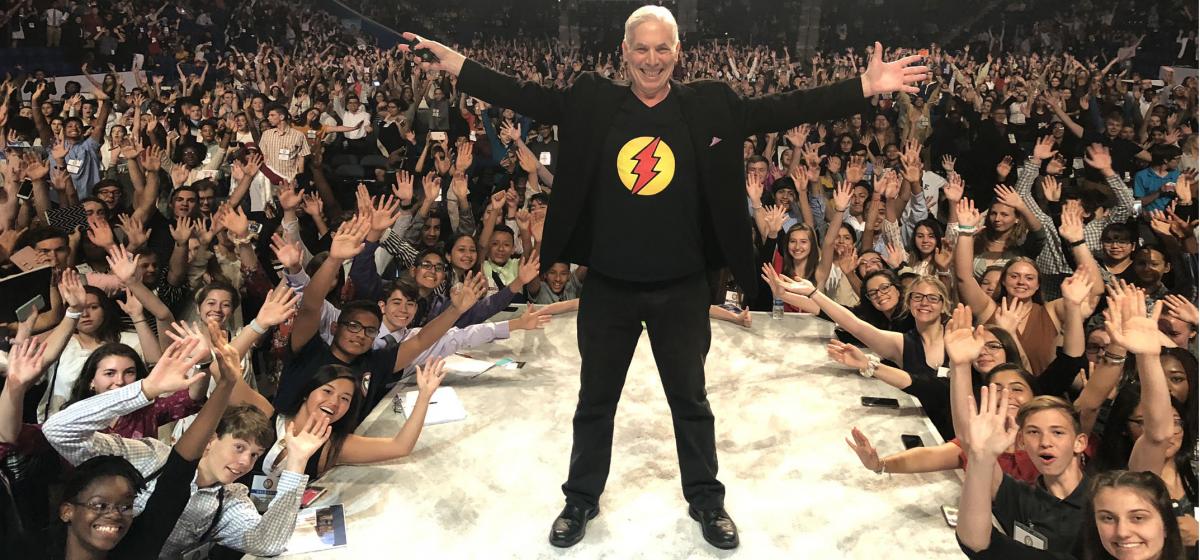 Michael Gelb on stage in front of a crowd