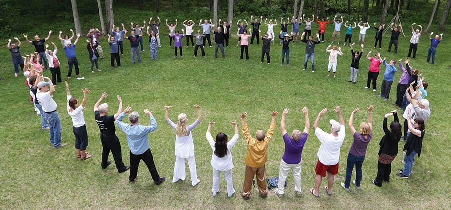 Group of people in a circle at Super Qi event