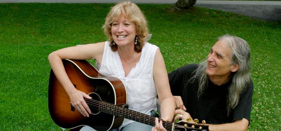 Jimmie Dale Gilmore helping someone play guitar