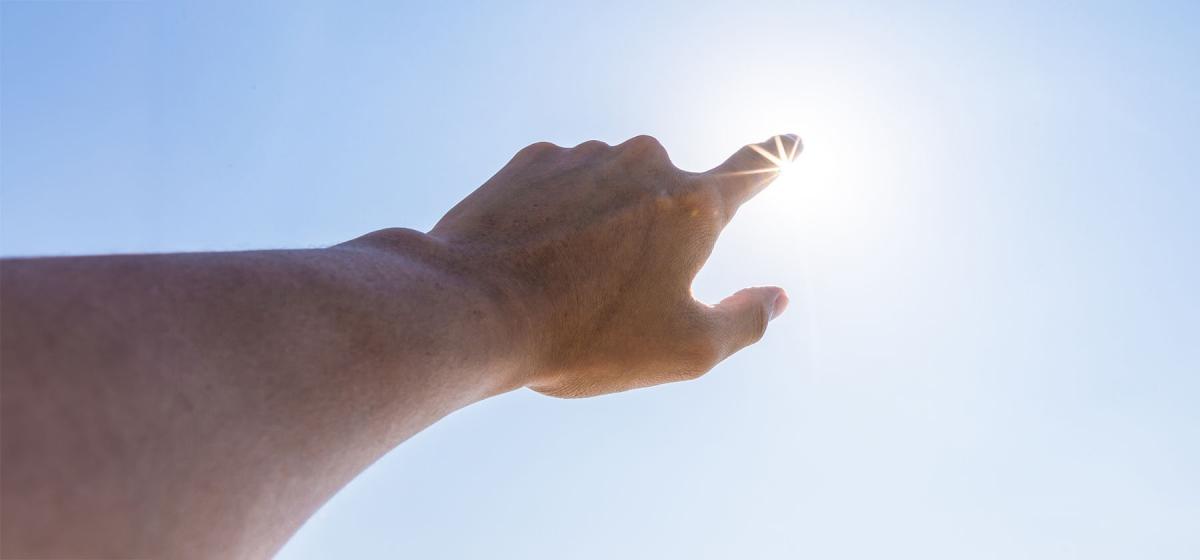 Person reaching for the light