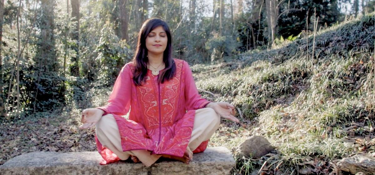 Shamini Jain meditating in the woods