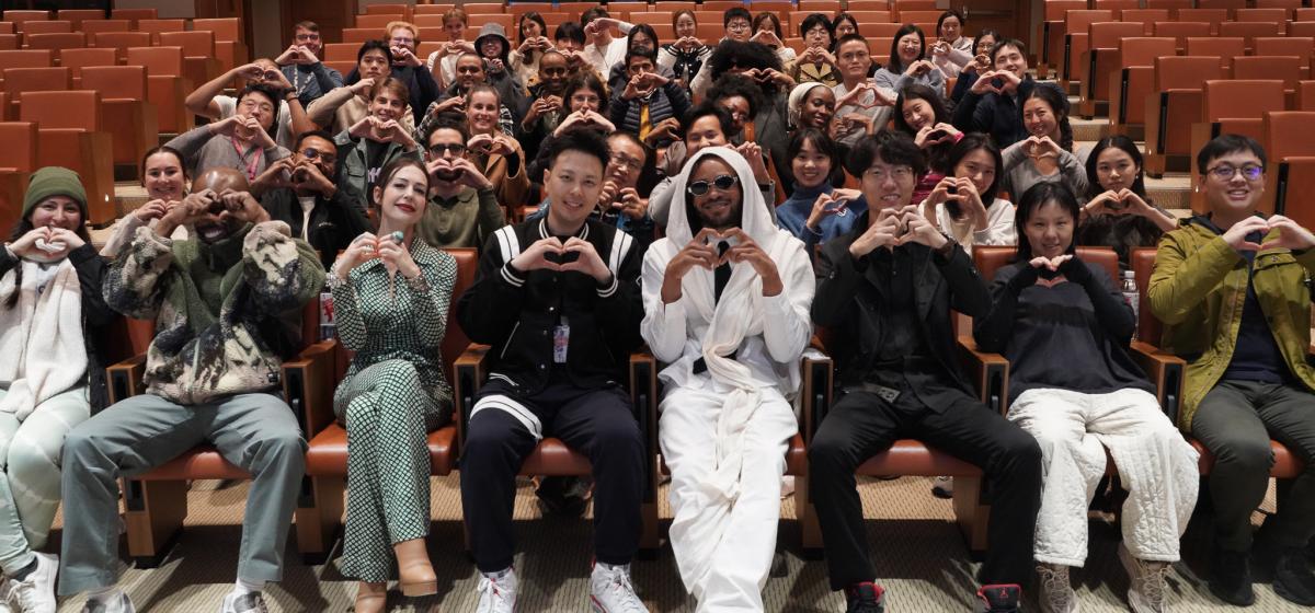 Group of participants at a workshop with Maejor