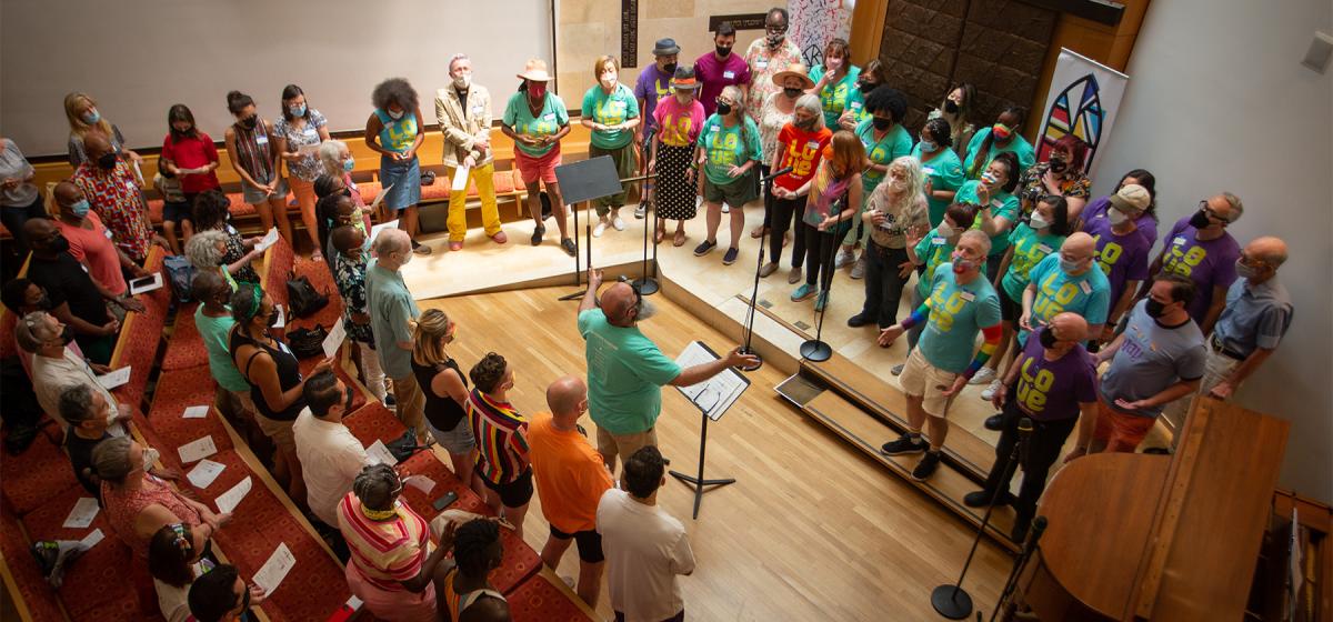 Group singing, led by John del Cueto