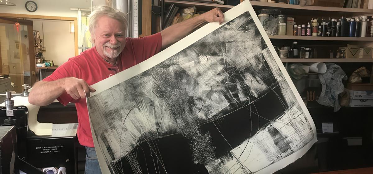 Dan Welden holding up a print