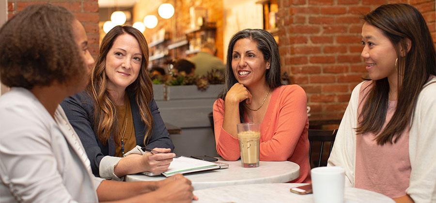 Group of women at a conference table