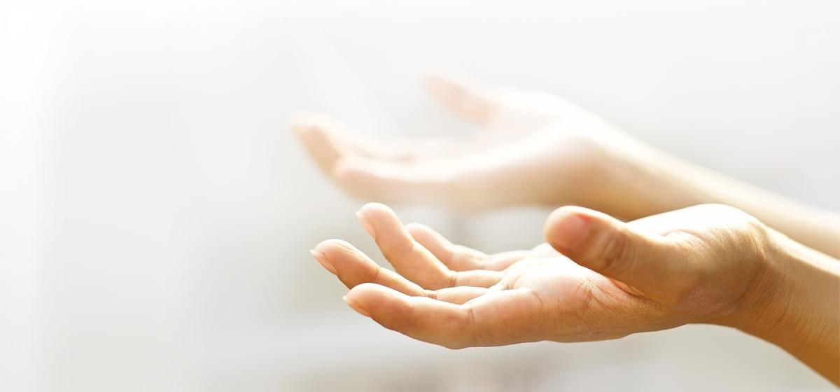 Hands in a foggy energy field