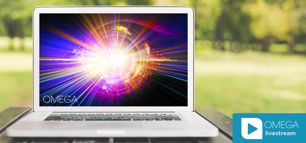 Cosmic vortex on laptop with Omega livestream logo
